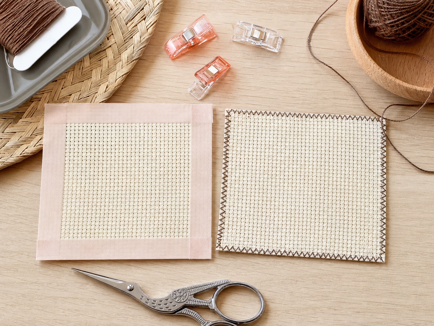 Two Aida fabric squares with secured edges